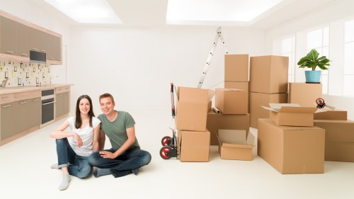 Professional movers handling furniture