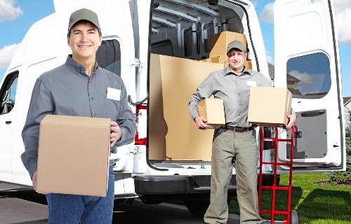 Unpacking services arranging furniture in a new home